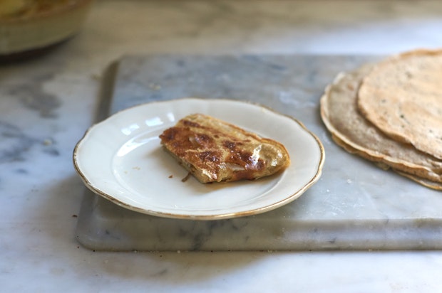 cooked rye crepe with fillings on a plate