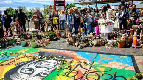 Getty Images Community members gather to mourn George Floyd