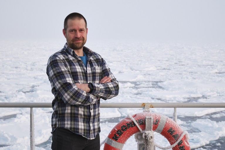Kjetil Våge stands on the helicopter deck of Kronprins Haakon in the ice-covered Greenland Sea.