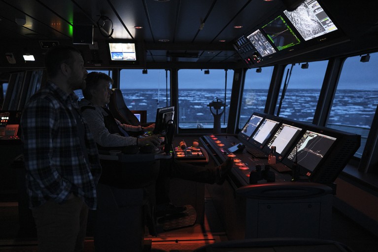 Kjetil Våge and captain Hallgeir M. Johansen on the bridge of Kronprins Haakon