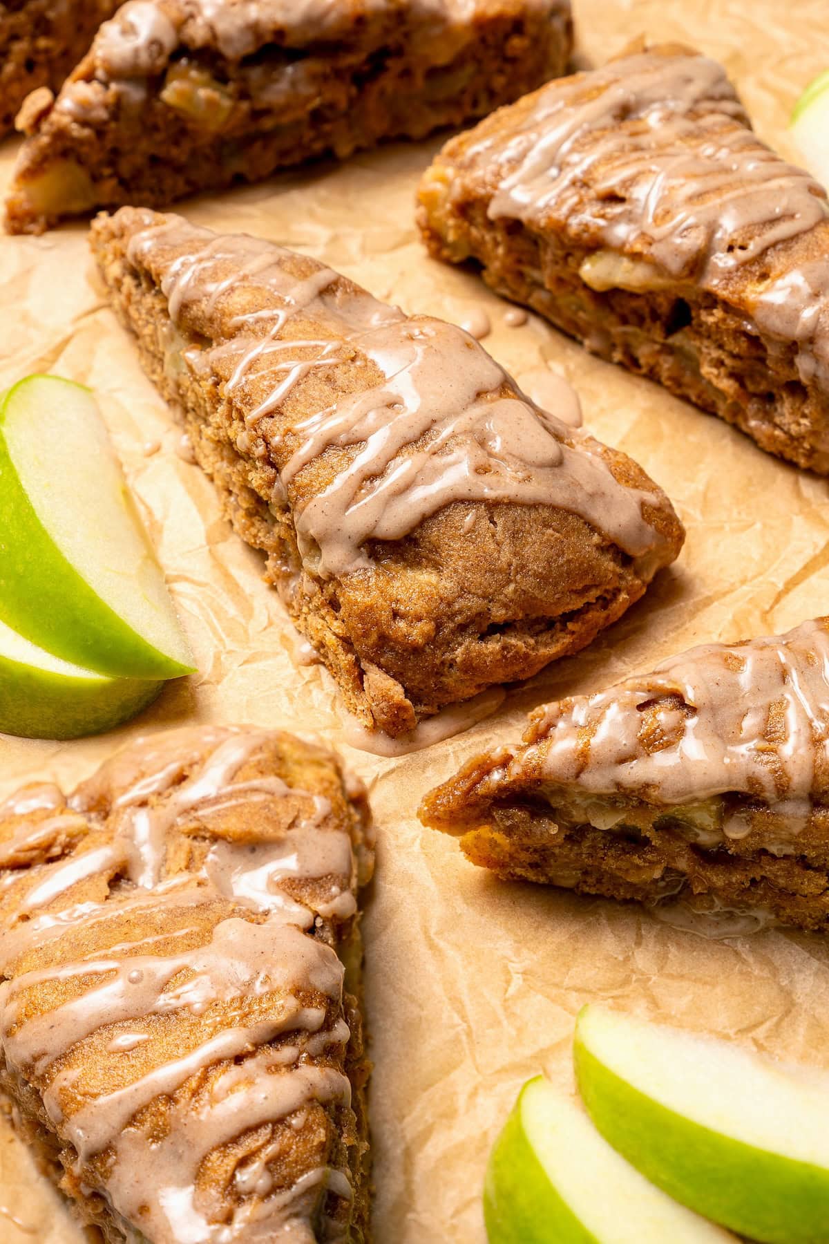 Glazed apple scones set on parchment paper