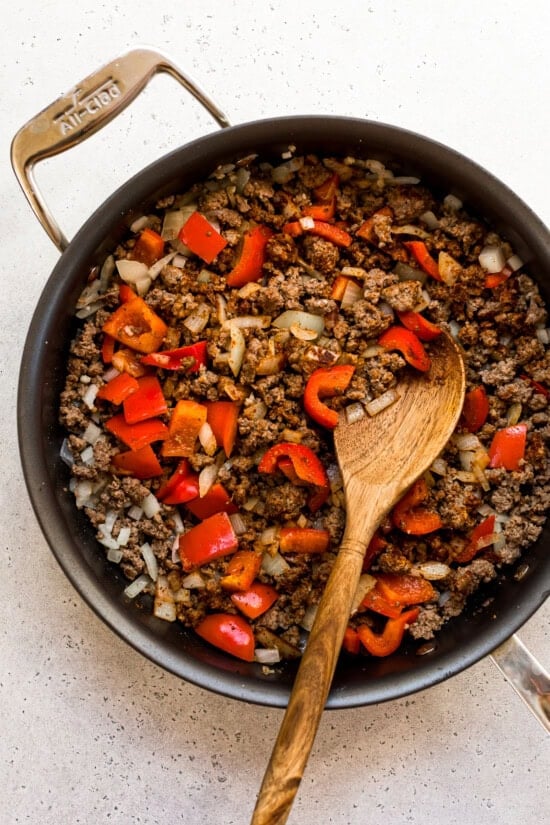 Saute onions, peppers and spices