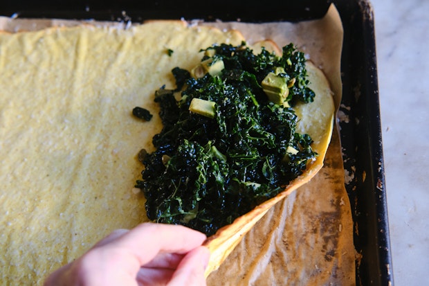 Cottage cheese wrap filled with kale before rolling